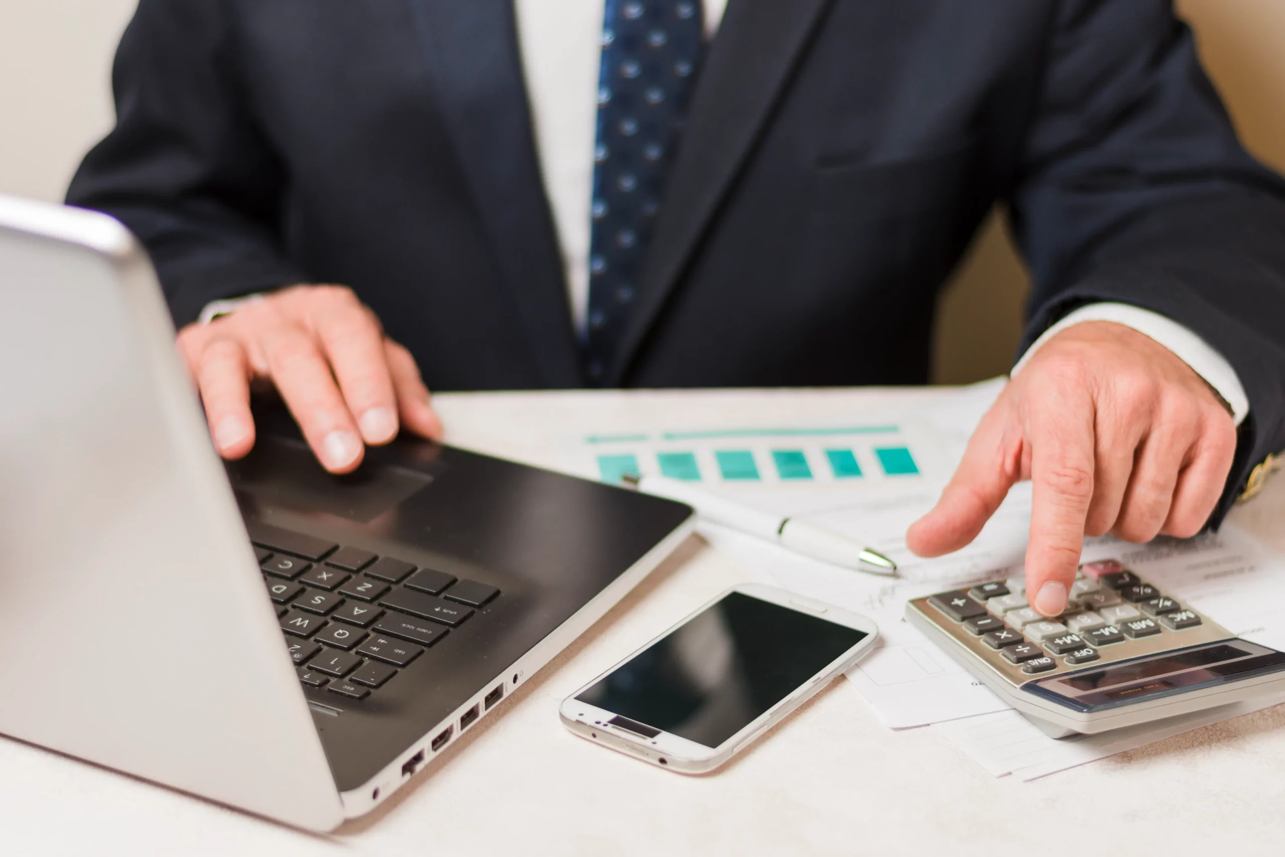 1-businessman-using-calculator