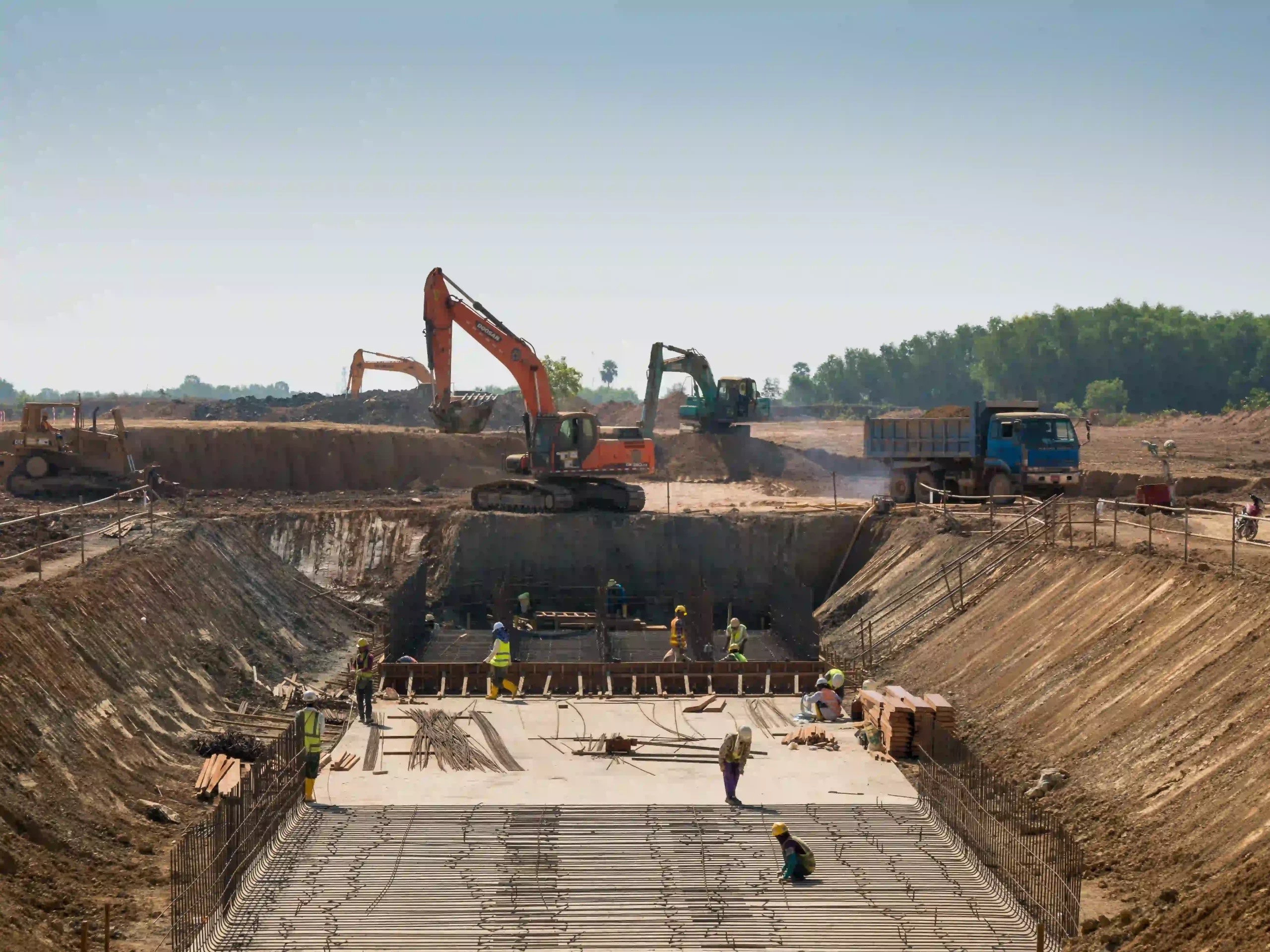 1-heavy-machines-construction-workers-working-building